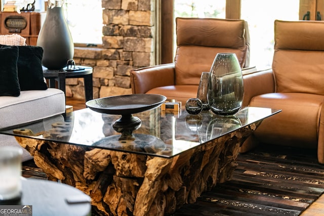 sitting room with plenty of natural light and hardwood / wood-style floors