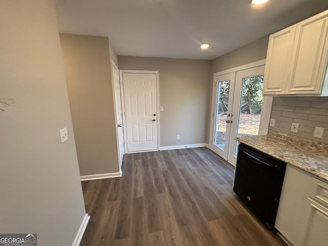 kitchen with dishwasher, dark wood-type flooring, decorative backsplash, light stone countertops, and white cabinetry