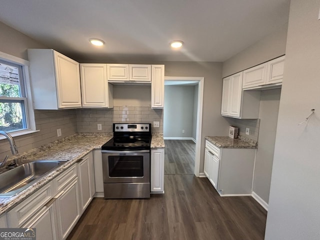 kitchen featuring dark wood-type flooring, white cabinets, electric stove, sink, and light stone countertops