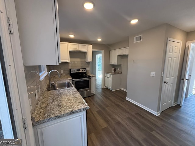 kitchen featuring electric range, sink, dark wood-type flooring, backsplash, and white cabinets