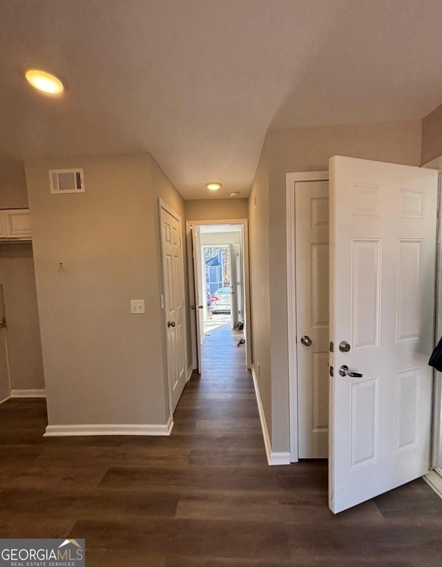 hall with dark hardwood / wood-style floors