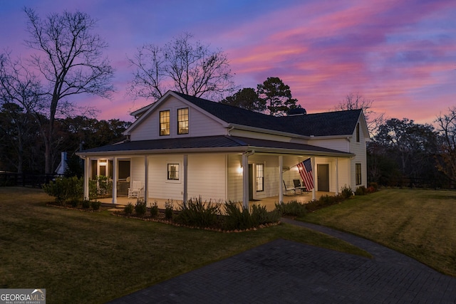 view of front of home with a lawn