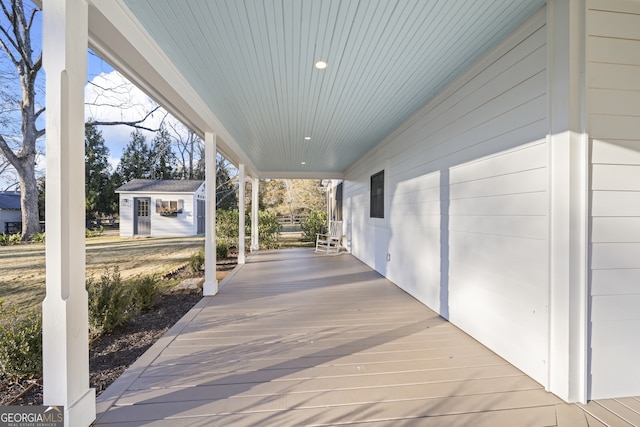 view of patio featuring covered porch and an outdoor structure