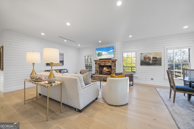 living room featuring a fireplace and light hardwood / wood-style floors