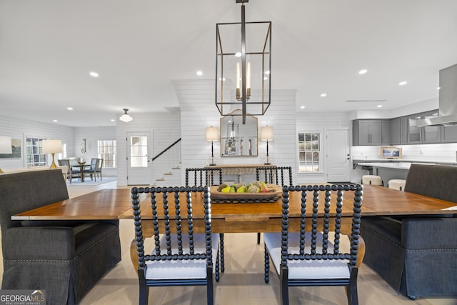 dining space featuring a chandelier and light hardwood / wood-style flooring