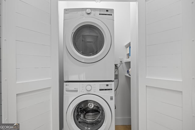 washroom with stacked washer and clothes dryer