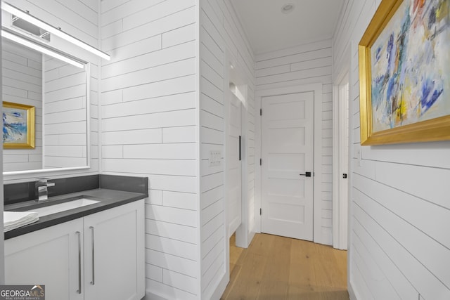 bathroom featuring hardwood / wood-style flooring and vanity