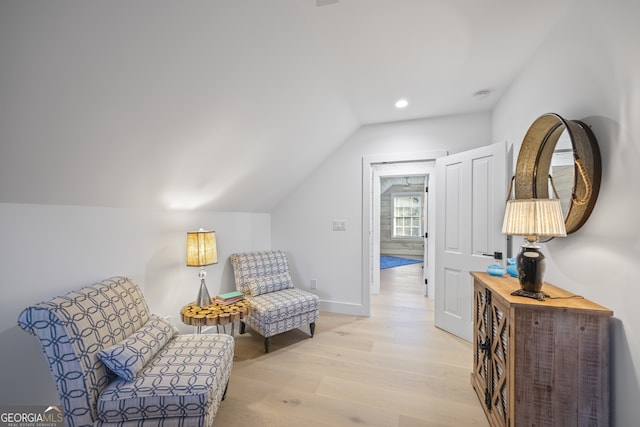 sitting room with lofted ceiling and light hardwood / wood-style flooring