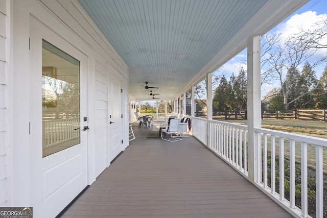 wooden terrace with a porch