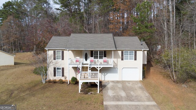 view of front of house with a porch and a front yard