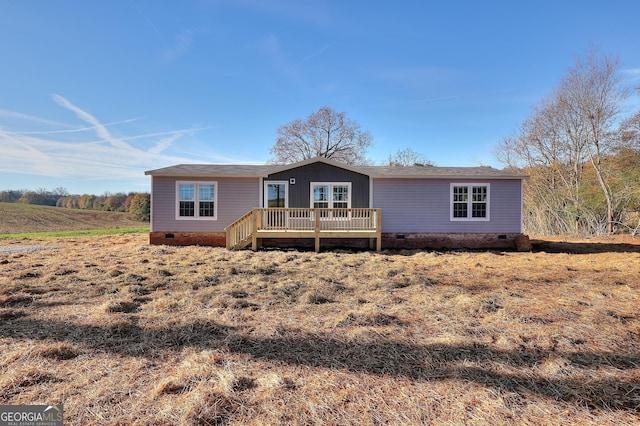 view of front of house featuring a wooden deck