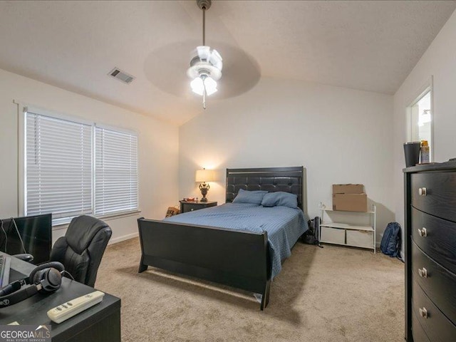 carpeted bedroom featuring vaulted ceiling and ceiling fan