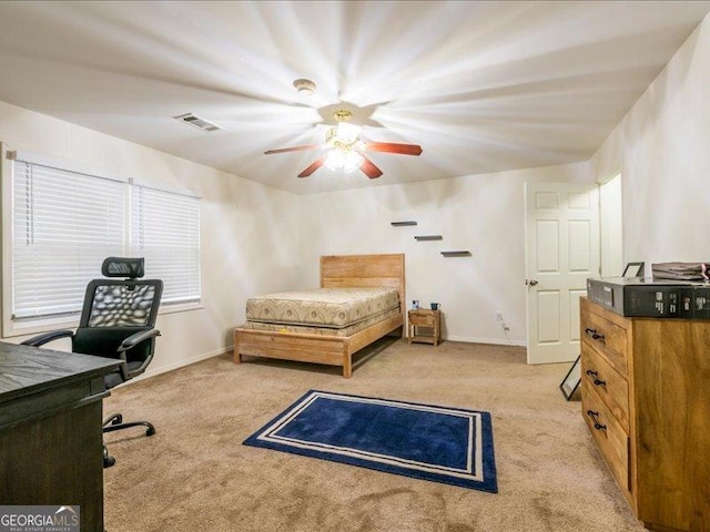 bedroom featuring light carpet and ceiling fan