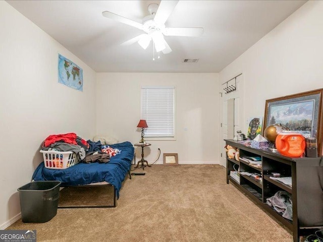 bedroom with ceiling fan and light colored carpet