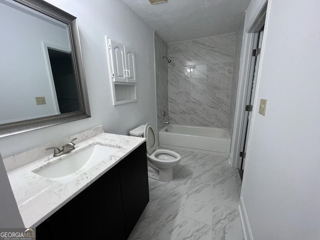 full bathroom with toilet, vanity, a textured ceiling, and tiled shower / bath