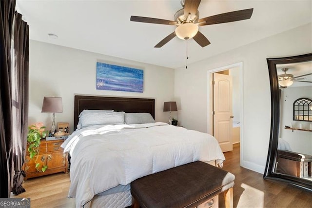 bedroom with ceiling fan and hardwood / wood-style floors