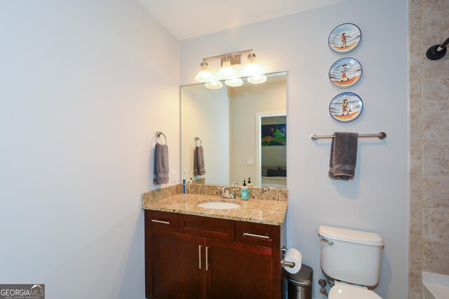 bathroom with vanity and toilet