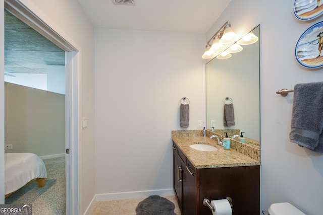 bathroom with vanity and toilet