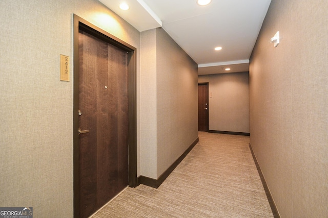 corridor with light colored carpet