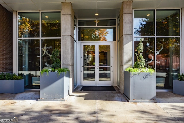 view of exterior entry featuring french doors