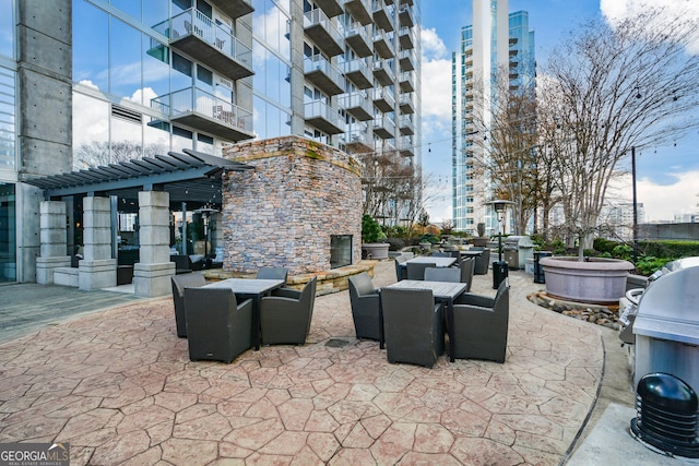 view of patio / terrace featuring a pergola and area for grilling