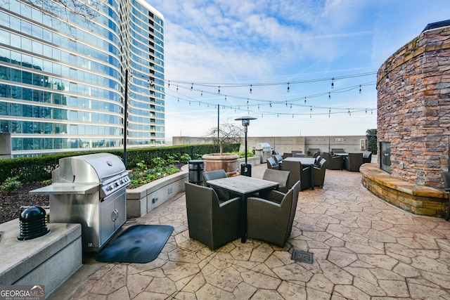 view of patio / terrace with outdoor lounge area and a grill