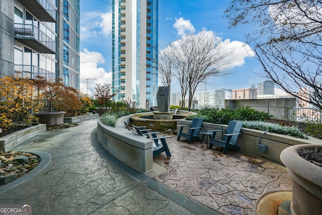 view of home's community with a patio area