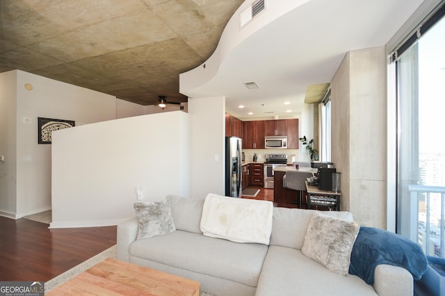 living room with dark hardwood / wood-style flooring