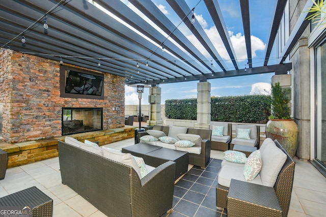 view of patio / terrace featuring an outdoor living space with a fireplace