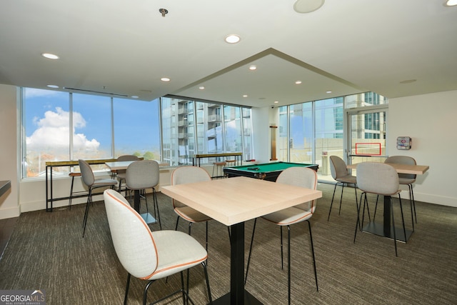 dining space featuring expansive windows and pool table