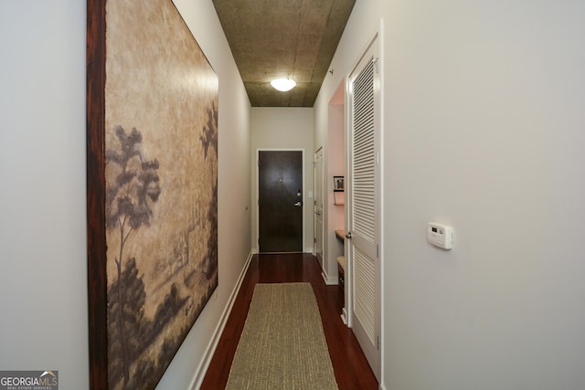 hallway with dark wood-type flooring