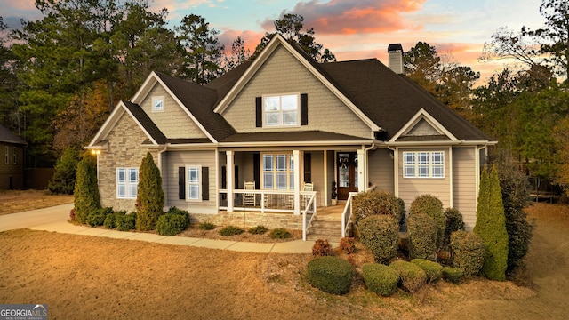 craftsman inspired home featuring covered porch