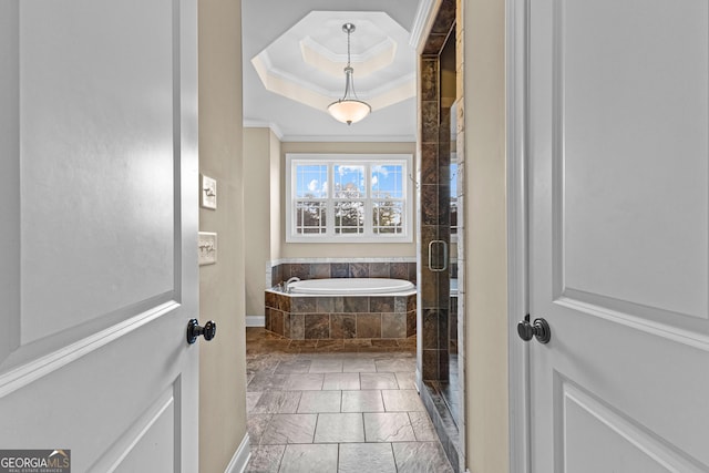 bathroom with shower with separate bathtub and ornamental molding