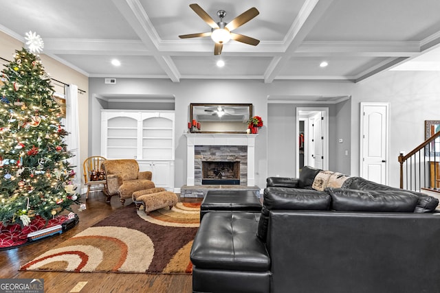 living room featuring beamed ceiling, wood-type flooring, and coffered ceiling