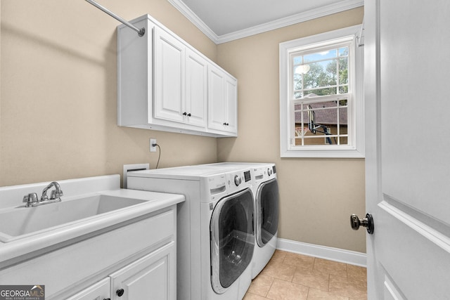 washroom with cabinets, crown molding, sink, light tile patterned floors, and separate washer and dryer