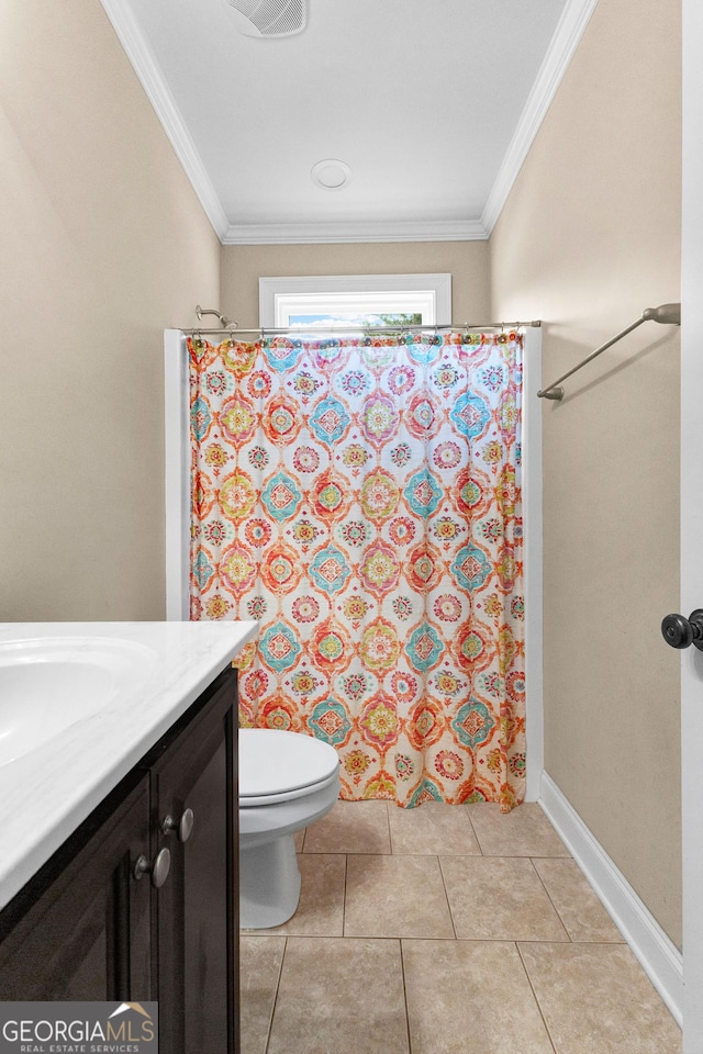 bathroom featuring tile patterned flooring, vanity, toilet, and ornamental molding