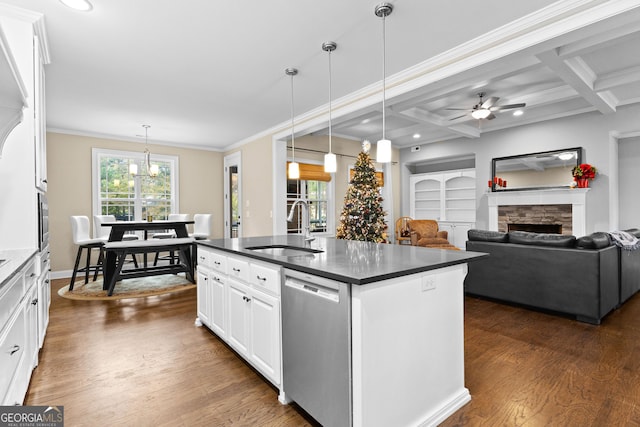 kitchen with coffered ceiling, sink, dishwasher, white cabinetry, and hanging light fixtures