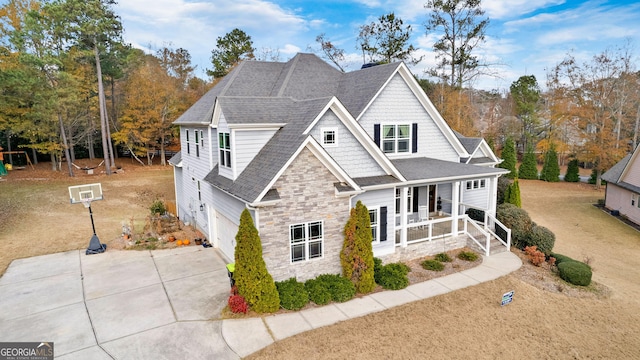 view of front of home with covered porch and a garage