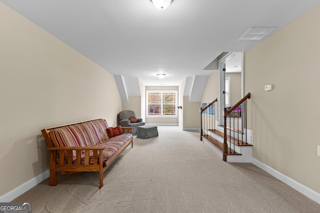 living area with light colored carpet