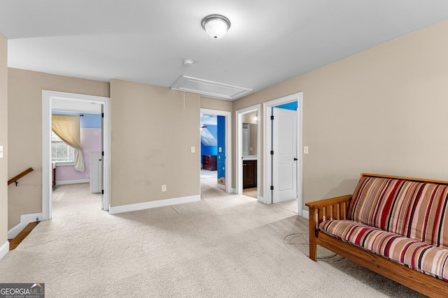 living area featuring light colored carpet