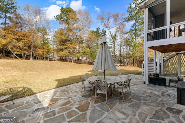 view of patio / terrace featuring a sunroom