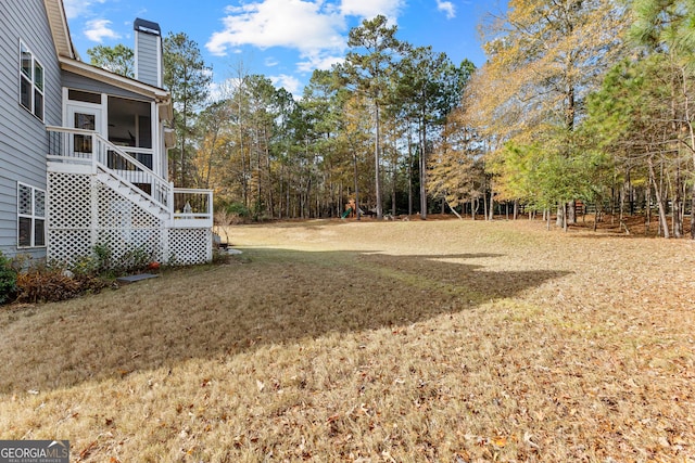 view of yard featuring a sunroom