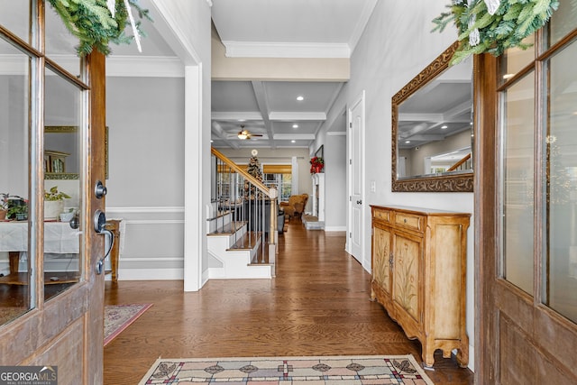 entrance foyer with beamed ceiling, crown molding, dark wood-type flooring, and coffered ceiling