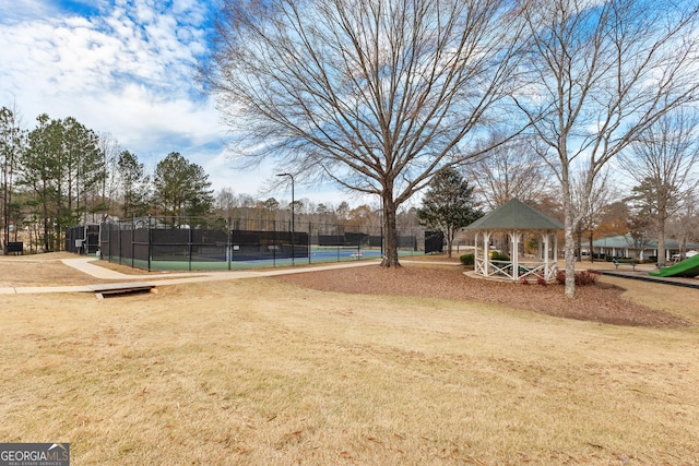 view of property's community with a gazebo and tennis court