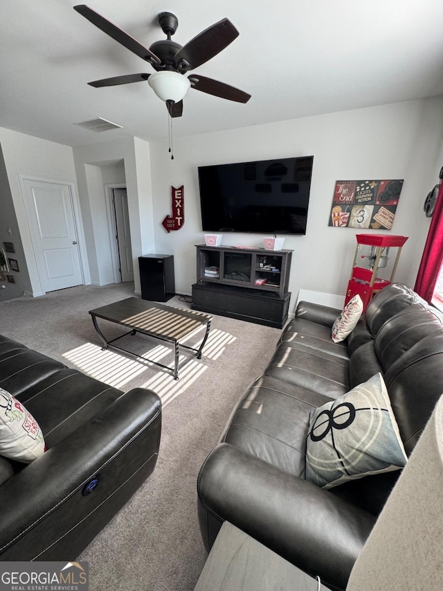 living room with carpet and ceiling fan