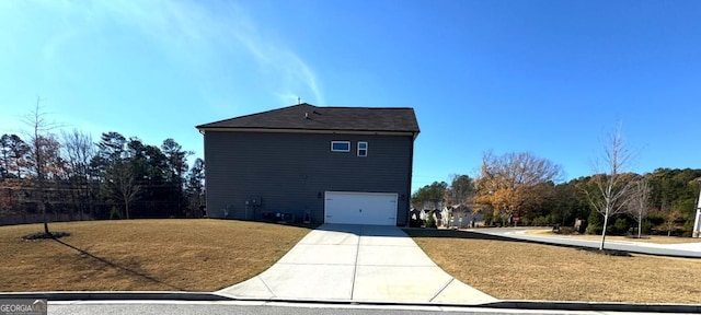 view of side of property featuring a garage