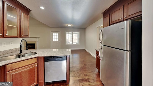 kitchen with hardwood / wood-style floors, sink, and stainless steel appliances