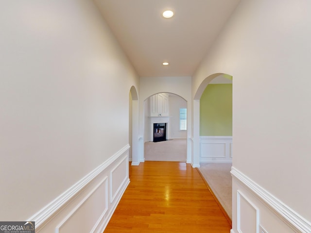 hall with light hardwood / wood-style floors