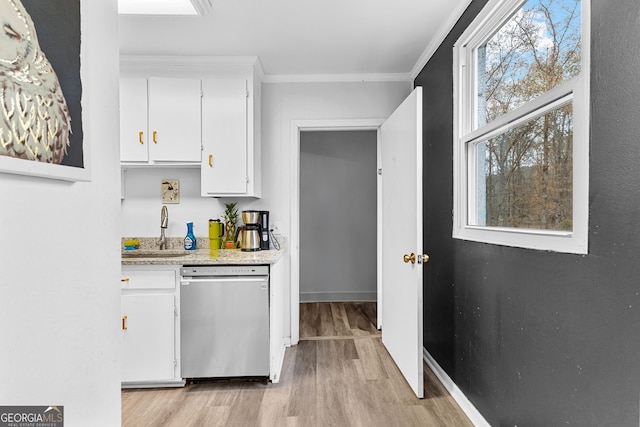 kitchen featuring white cabinetry, dishwasher, light wood-type flooring, and sink