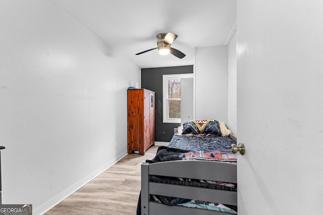 bedroom with light wood-type flooring and ceiling fan